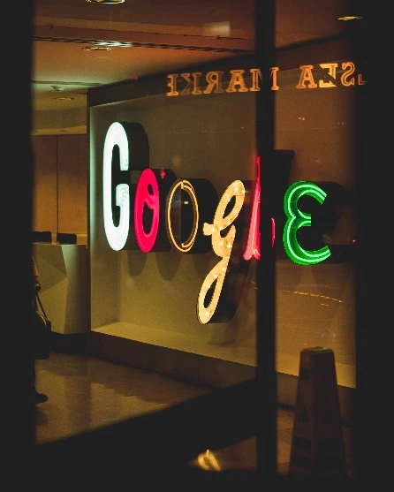 Photo of the google logo through a window